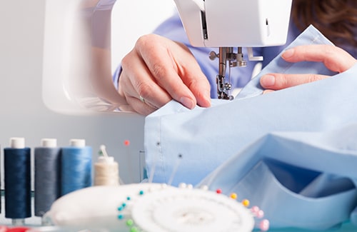 Clothing alterations in progress with sewing machine